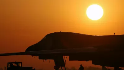 The sun rises behind a B-1B Lancer military plane parked at RAF Fairford airbase after a two-week ceasefire in the Iran war was announced, in Fairford, Gloucestershire, Britain, April 8, 2026. REUTERS/Toby Melville