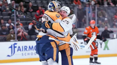 Nashville Predators' right wing Joakim Kemell (25) hugs goaltender Justus Annunen (29) after an NHL hockey game against the Anaheim Ducks, Tuesday, April 7, 2026, in Anaheim, Calif.. (AP Photo/Scott Strazzante)