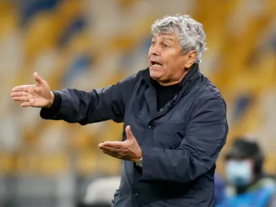 FILE - Dynamo Kiev's head coach Mircea Lucescu gives instructions during the Champions League Play-offs, 2nd leg soccer match between Gent and Dynamo Kyiv in Kyiv, Ukraine, Tuesday, Sept. 29, 2020. (AP Photo/Efrem Lukatsky, File)