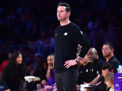 April 7, 2026; Los Angeles, California, USA; Los Angeles Lakers head coach JJ Redick watches game action against the Oklahoma City Thunder during the first half at Crypto.com Arena. Mandatory Credit: Gary A. Vasquez-Imagn Images