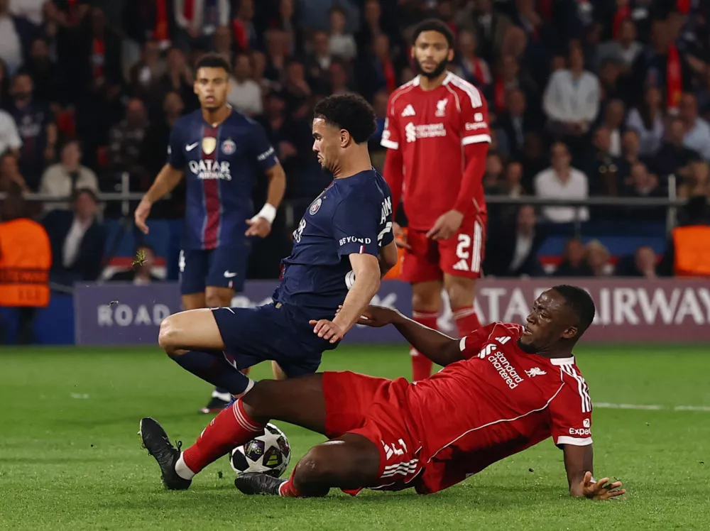 Soccer Football - UEFA Champions League - Quarter Final - First Leg - Paris St Germain v Liverpool - Parc des Princes, Paris, France - April 8, 2026 Liverpool's Ibrahima Konate fouls Paris St Germain's Warren Zaire-Emery to concede a penalty before it is overturned after a VAR review Action Images via Reuters/Lee Smith