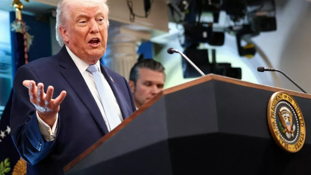 FILE PHOTO: U.S. President Donald Trump, flanked by Secretary of Defense Pete Hegseth, speaks during a press conference in the James S. Brady Press Briefing Room at the White House in Washington, D.C., U.S., April 6, 2026. REUTERS/Kevin Lamarque/File Photo