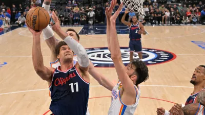 Apr 8, 2026; Inglewood, California, USA; Oklahoma City Thunder center Chet Holmgren (7), center Isaiah Hartenstein (55) defend a shot by Los Angeles Clippers center Brook Lopez (11) in the first half at Intuit Dome. Mandatory Credit: Jayne Kamin-Oncea-Imagn Images