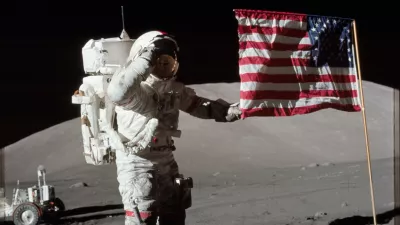 6261520 Astronaut Eugene A. Cernan, Apollo 17 commander, is photographed next to the deployed United States flag during lunar surface extravehicular activity (EVA) at the Taurus-Littrow landing site. The highest part of the flag appears to point toward our planet Earth in the distant background, 1972 (photo). No Use Germany. No Use Italy.