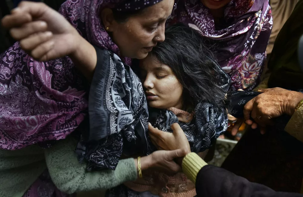 West, Central, and South Asia | Singles | A Daughter's Grief in KashmirSanam Bashir, 21, collapses with grief at her mother's funeral. Nargis Begum, 45, died from shrapnel wounds after a mortar shell struck while the two were fleeing their home. Uri, Jammu and Kashmir, India, 9 May 2025. The Kashmir region has been contested between India and Pakistan since the 1947 partition of British India, a dispute that has fuelled decades of conflict. On 22 April 2025, an attack on tourists in Pahalgam killed 26 people. India blamed Pakistan-backed militant groups and responded with strikes on 7 MayPhotograph: Yasir Iqbal, Outlook India Magazine/World Press Photo 2026