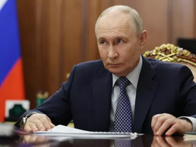 Russian President Vladimir Putin listens to Deputy Prime Minister, Chief of the Government Staff Dmitry Grigorenko during their meeting at the Kremlin, in Moscow, Thursday, April 9, 2026. (Alexander Kazakov/Sputnik, Kremlin Pool Photo via AP)