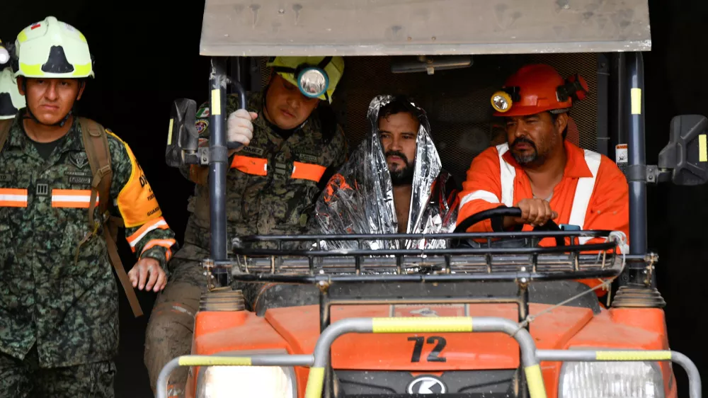 Members of rescue teams transport miner Francisco Zapata Najera, 42, after he was rescued during a search for four miners following a collapse at the Minerales de Sinaloa mine, in the municipality of El Rosario, Sinaloa state, Mexico, April 8, 2026. REUTERS/Stringer