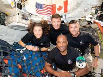 FILE PHOTO: The NASA Artemis II crew, Mission Specialist Christina Koch, Mission Specialist Jeremy Hansen, Commander Reid Wiseman, and Pilot Victor Glover, pose for a group photo inside the Orion spacecraft on their way home following a flyby of the far side of the Moon on April 6, 2026. NASA/Handout via REUTERS THIS IMAGE HAS BEEN SUPPLIED BY A THIRD PARTY. REFILE - CORRECTING DATE FROM "APRIL 6" TO "APRIL 7".  TPX IMAGES OF THE DAY/File Photo