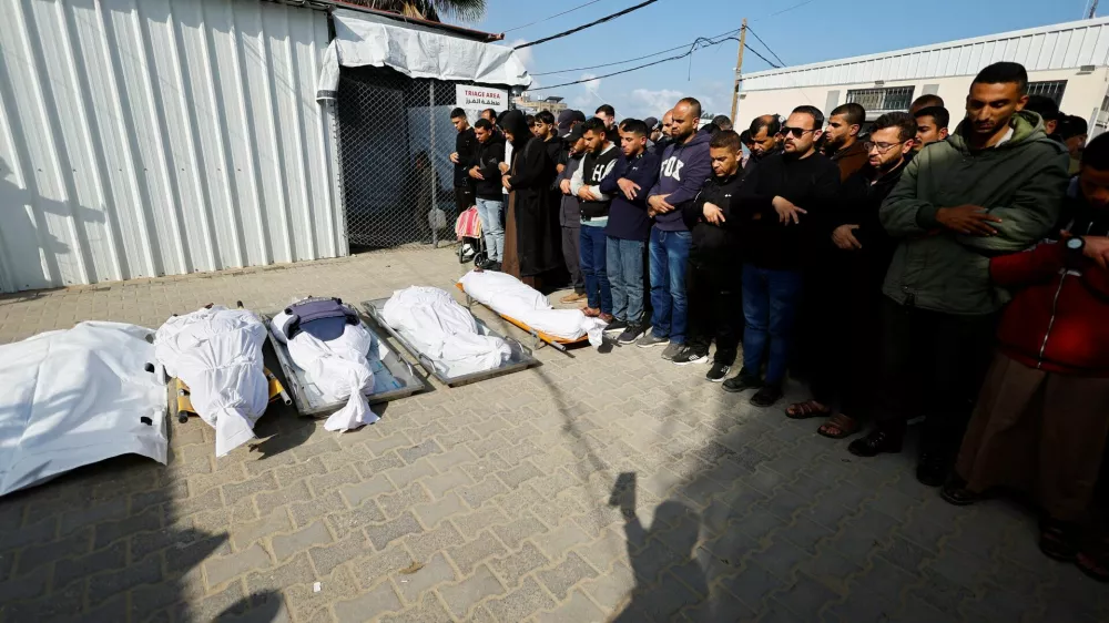 Mourners pray during the funeral of Palestinians who were killed in an Israeli strike, according to medics, at Al-Aqsa Martyrs Hospital in Deir al-Balah, central Gaza Strip, April 11, 2026. REUTERS/Mahmoud Issa