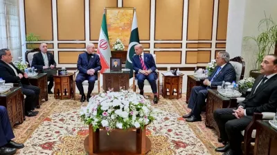 In this photo released by the Pakistan Prime Minister Office, visiting Iranian delegation headed by Iran's Parliament Speaker Mohammad Bagher Ghalibaf, third left, meet with Pakistani Prime Minister Shehbaz Sharif, in Islamabad, Pakistan, Saturday, April 11, 2026 (Pakistan Prime Minister Office via AP)
