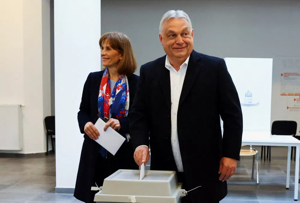 Hungarian Prime Minister Viktor Orban and his wife Aniko Levai vote during the Hungarian parliamentary election in Budapest, Hungary, April 12, 2026. REUTERS/Bernadett Szabo   TPX IMAGES OF THE DAY