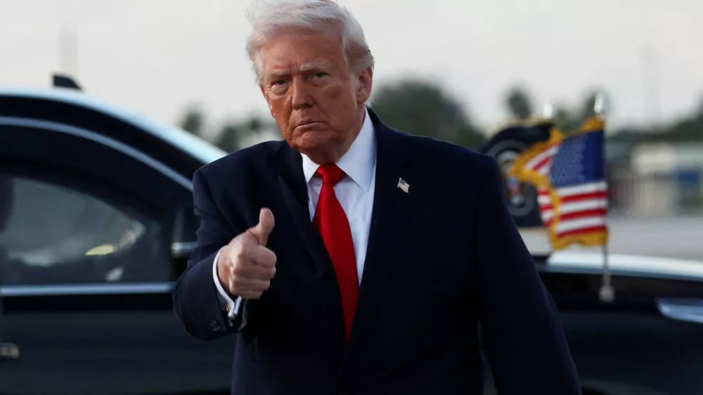 U.S. President Donald Trump gives a thumbs up as he arrives at Miami International Airport in Florida, U.S., April 11, 2026. REUTERS/Kevin Lamarque