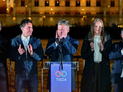 Peter Magyar, leader of the opposition Tisza party, and other officials celebrate following the partial results of the parliamentary election, in Budapest, Hungary, April 12, 2026. REUTERS/Marton Monus