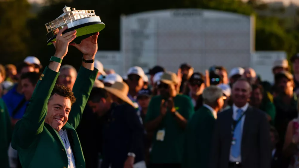 Rory McIlroy, of Northern Ireland, holds the trophy after winning the Masters golf tournament at the Augusta National Golf Club, Sunday, April 12, 2026, in Augusta, Ga.(AP Photo/Matt Slocum)