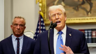 FILE PHOTO: U.S. President Donald Trump, next to U.S. Secretary of Health and Human Services Robert F. Kennedy Jr., makes an announcement linking autism to childhood vaccines and to the use of popular pain medication Tylenol for pregnant women and children, claims which are not backed by decades of science, at the White House, in Washington, D.C., U.S., September 22, 2025. REUTERS/Kevin Lamarque/File Photo