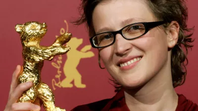 Bosnian director Jasmila Zbanic poses with her Golden Berlin Bear award after the awarding ceremony at the 56th Berlinale International Film Festival in Berlin on Saturday, Feb. 18, 2006. Zbanic won the award for the Best Film 'Gbravica'. (AP Photo/Arnd Wiegmann, Pool)