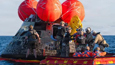 NASA Astronaut Reid Wiseman, Artemis II mission commander, exits the Orion crew module to join the three other crew in a raft, before transiting to the U.S. Navy ship USS John P. Murtha in the Pacific Ocean off the coast of California, U.S. April 10, 2026. NASA's Artemis II mission sent four astronauts on a flight around the moon in the Orion space capsule, which splashed down after the ten day journey. U.S. Navy/Mass Communication Specialist David Rowe/Handout via REUTERS THIS IMAGE HAS BEEN SUPPLIED BY A THIRD PARTY. THIS IMAGE WAS PROCESSED BY REUTERS TO ENHANCE QUALITY, AN UNPROCESSED VERSION HAS BEEN PROVIDED SEPARATELY.