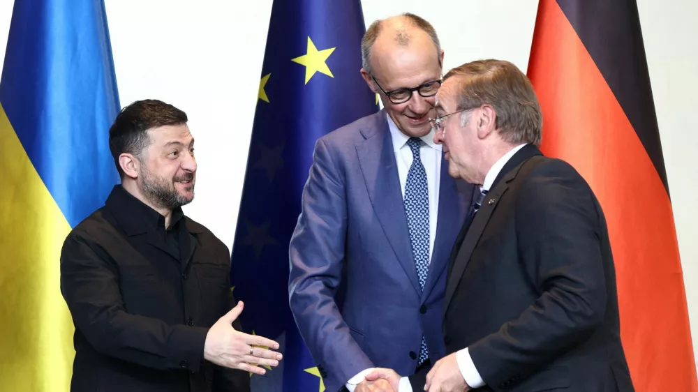 German Chancellor Friedrich Merz, Ukrainian President Volodymyr Zelenskiy, and German Defence Minister Boris Pistorius attend a signing ceremony during the German-Ukrainian government consultations, at the Chancellery in Berlin, Germany, April 14, 2026. REUTERS/Liesa Johannssen