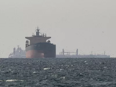 FILE PHOTO: FILE PHOTO: Cargo ships in the Gulf, near the Strait of Hormuz, as seen from northern Ras al-Khaimah, near the border with Oman's Musandam governance, amid the U.S.-Israeli conflict with Iran, in United Arab Emirates, March 11, 2026. REUTERS/Stringer/File Photo/File Photo