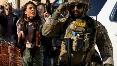 Community members and rapid responders yell at federal immigration enforcement agents after they detained two men outside a Home Depot in Evanston in Evanston, Ill., Wednesday, Dec. 17, 2025. (Ashlee Rezin/Chicago Sun-Times via AP)