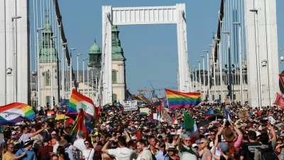 FILE PHOTO: People cross the Elisabeth Bridge during the Budapest Pride March in Budapest, Hungary, June 28, 2025. REUTERS/Bernadett Szabo/File Photo