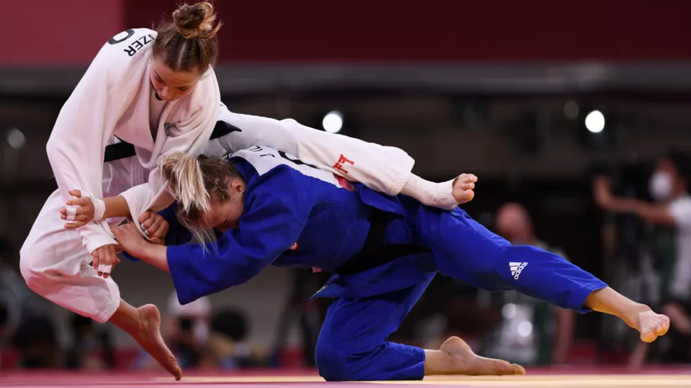 Tokyo 2020 Olympics - Judo - Women's 57kg - Bronze medal match - Nippon Budokan - Tokyo, Japan - July 26, 2021. Kaja Kajzer of Slovenia in action against Jessica Klimkait of Canada REUTERS/Annegret Hilse