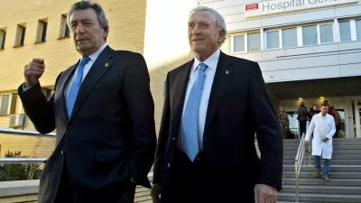 FILE -Former Real Madrid soccer players Enrique Perez "Pachin", left, and Jose Emilio Santamaria leave La Fe hospital in Valencia, Spain, Dec. 27, 2005 after visiting their former teammate Alfredo di Stefano, of Argentina. (AP Photo/Fernando Bustamante, File)