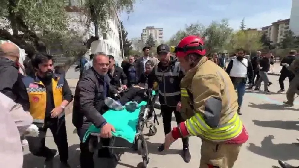 An injured person is carried to an ambulance following a school shooting, in the southeastern province of Kahramanmaras, Turkey, April 15, 2026. IHA (Ihlas News Agency) via REUTERS ATTENTION EDITORS - THIS PICTURE WAS PROVIDED BY A THIRD PARTY