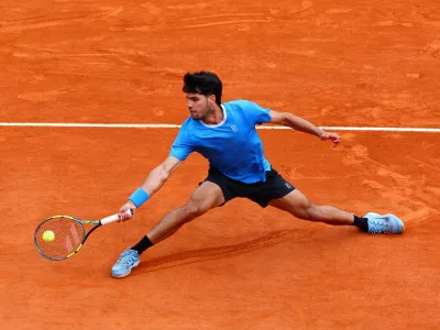 Tennis - ATP Masters 1000 - Monte Carlo Masters - Monte Carlo Country Club, Roquebrune-Cap-Martin, France - April 12, 2026 Spain's Carlos Alcaraz in action during his final match against Italy's Jannik Sinner REUTERS/Manon Cruz