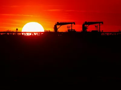 Deck cranes on the deck of an oil tanker anchored near the oil hub of the port of Fos-Lavera at sunset near Marseille, southern France, April 14, 2026. REUTERS/Manon Cruz