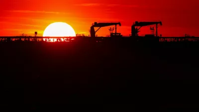 Deck cranes on the deck of an oil tanker anchored near the oil hub of the port of Fos-Lavera at sunset near Marseille, southern France, April 14, 2026. REUTERS/Manon Cruz
