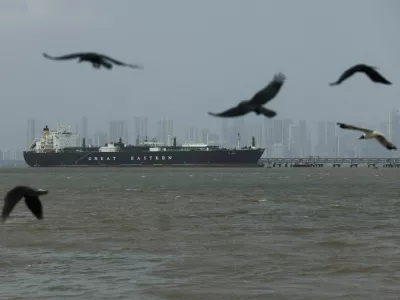 FILE PHOTO: Birds fly near the Jag Vasant vessel transferring LPG at a port after transiting the Strait of Hormuz amid supply disruptions linked to the U.S-Israeli conflict with Iran, in Mumbai, India, April 1, 2026. REUTERS/Francis Mascarenhas/File Photo