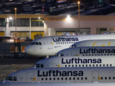 Lufthansa aircraft are parked at Frankfurt Airport, in Frankfurt, Germany, Friday, April 10, 2026, as the cabin crew of Lufthansa and its subsidiary Lufthansa Cityline to go on strike. (Hannes P. Albert/dpa via AP)