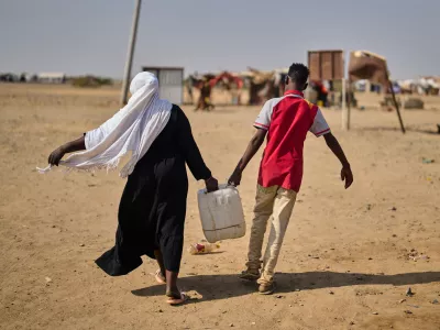 Internally displaced Sudanese people haul water in a container at the Al Heshan camp in Port Sudan, Sudan, Wednesday, April 15, 2026. (AP Photo/Bernat Armangue)