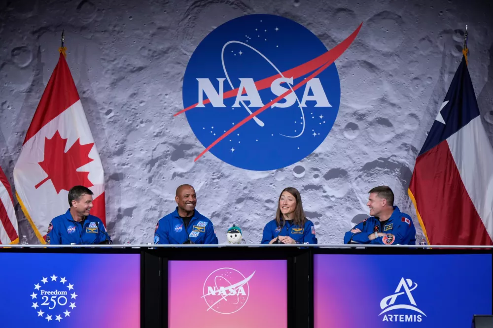NASA's Artemis II crew - NASA astronauts Reid Wiseman, Victor Glover, and Christina Koch, and Canadian Space Agency (CSA) astronaut Jeremy Hansen speak during a press conference on Thursday, April 16, 2026, in Houston. (AP Photo/Ashley Landis)