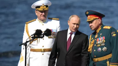 HANDOUT - 30 July 2023, Russia, Saint Petersburg: Russian President Vladimir Putin (C) stands with Russian Defence Minister Sergei Shoigu (R) and Russian Navy Admiral Nikolai Yevmenov during the Naval Parade marking the Russian Navy Day. Photo: -/Kremlin/dpa - ATTENTION: editorial use only and only if the credit mentioned above is referenced in full