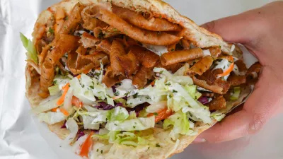 FILED - 19 February 2018, Brandenburg, Frankfurt an der Oder: A person holds a Doner Kebab. Survey: Doner kebab topples currywurst as Germany's ruling fast food. Photo: Patrick Pleul/dpa-Zentralbild/ZB
