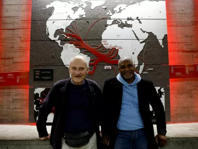 FILE PHOTO: Pierre Guillon de Prince, a 83-year-old descendant of a famous Nantes family whose ancestors were owners of ships transporting enslaved people, and Dieudonne Boutrin, a 59-year-old descendant of enslaved Africans in Martinique, president of the association La Coque Nomade-Fraternite, a human right association in Nantes which campaigns on slavery and reparations, pose at the Memorial to the Abolition of Slavery in Nantes, France, March 23, 2024. REUTERS/Stephane Mahe/File Photo