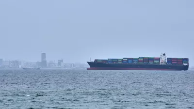 A container ship is seen in the Strait of Hormuz off the coast of Qeshm Island, Iran, Saturday, April 18, 2026. (AP Photo/Asghar Besharati)