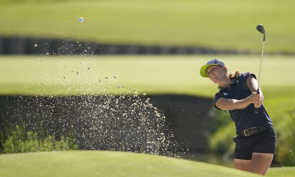 Pia Babnik, of Slovenia, plays out of a bunker on the 18th green during the final round of the women's golf event at the 2024 Summer Olympics, Saturday, Aug. 10, 2024, at Le Golf National, in Saint-Quentin-en-Yvelines, France. (AP Photo/Matt York)