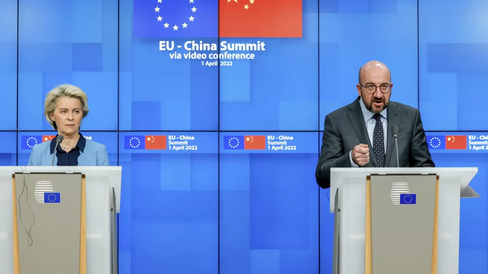 European Commission President Ursula von der Leyen, left, and European Council President Charles Michel speak during a media conference at the end of an EU China summit at the European Council building in Brussels, Friday, April 1, 2022. (AP Photo/Olivier Matthys)