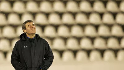 FILE PHOTO: Steaua Bucharest head coach Gheorghe Hagi looks at the sky as it rains during a practice session in Prague September 18, 2007. Steaua will play Slavia in a Champions League Group H soccer match on Wednesday in Prague. REUTERS/David W Cerny (CZECH REPUBLIC)/File Photo
