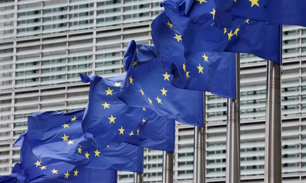FILE PHOTO: European Union flags flutter outside the EU Commission headquarters in Brussels, Belgium July 16, 2025. REUTERS/Yves Herman/File Photo