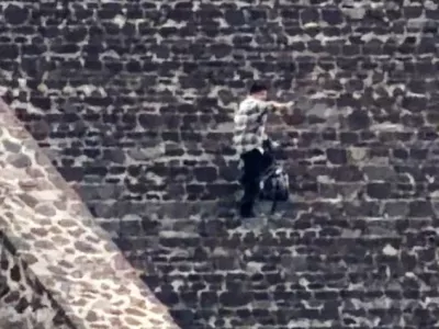 A man fires what appears to be a weapon during an incident where authorities say a Canadian woman was shot dead and several others injured before the gunman killed himself at the Teotihuacan pyramids, a popular tourist and archaeological site in San Martin de las Piramides, on the outskirts of Mexico City, Mexico, April 20, 2026, in this still image obtained from social media video. Barak Hardley/via REUTERS THIS IMAGE HAS BEEN SUPPLIED BY A THIRD PARTY. MANDATORY CREDIT. THIS PICTURE WAS PROCESSED BY REUTERS TO ENHANCE QUALITY. AN UNPROCESSED VERSION HAS BEEN PROVIDED SEPARATELY.   TPX IMAGES OF THE DAY    Verification: - Location and date verified by original file metadata - Facade of the pyramids, architectural features and trees matched file and satellite imagery.