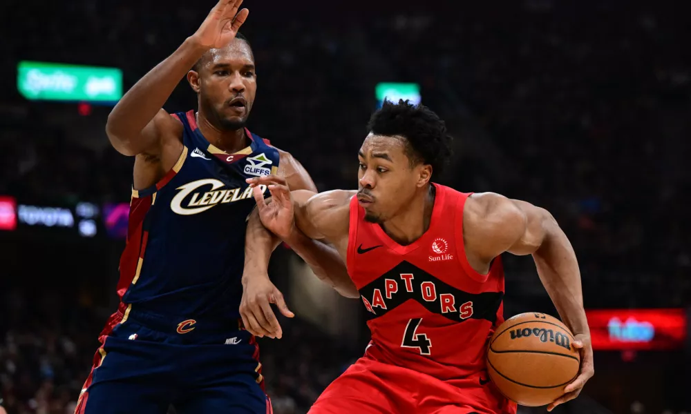 Apr 20, 2026; Cleveland, Ohio, USA; Toronto Raptors forward Scottie Barnes (4) drives on Cleveland Cavaliers center Evan Mobley (4) during the second half during game two of the first round of the 2026 NBA Playoffs at Rocket Arena. Mandatory Credit: David Dermer-Imagn Images