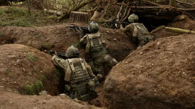 Ukrainian soldiers take part in a final tactical exercise on the fourth anniversary of Russia's full-scale invasion of Ukraine, held at a British Army training camp in East Anglia, Britain, February 24, 2026. REUTERS/Chris Radburn