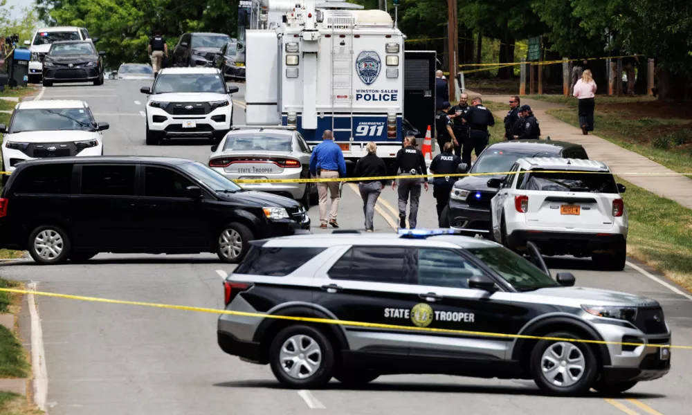 Winston-Salem police have a mobile command unit set up at the scene of a shooting at Leinbach Park, Monday, April 20, 2026, in Winston-Salem, N.C. (Allison Lee Isley/The Winston-Salem Journal via AP)