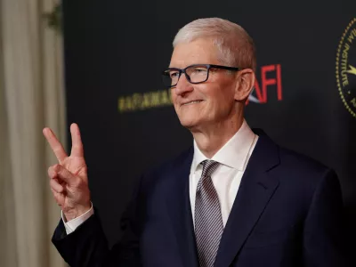 FILE PHOTO: Apple's CEO Tim Cook attends the American Film Institute (AFI) Awards Luncheon in Los Angeles, California, U.S., January 9, 2026. REUTERS/Mario Anzuoni/File Photo