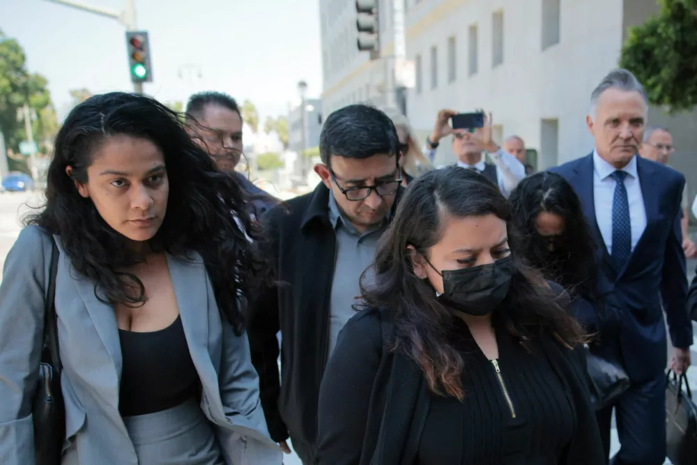 Attorney Patrick W. Steinfeld and family members of Celeste Rivas Hernandez, whose body was found on September 8, 2025, in the front trunk of a Tesla registered to musician known professionally as d4vd, arrive at a courthouse following the arrest of the 21-year-old singer, whose real name is David Anthony Burke, in Los Angeles, California, U.S., April 20, 2026. REUTERS/Daniel Cole