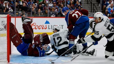 Apr 21, 2026; Denver, Colorado, USA; Colorado Avalanche goaltender Scott Wedgewood (41) watches as Los Angeles Kings right wing Quinton Byfield (55) is unable to control the puck as left wing Trevor Moore (12) and defenseman Brett Kulak (27) defend in the third period in game two of the first round of the 2026 Stanley Cup Playoffs at Ball Arena. Mandatory Credit: Isaiah J. Downing-Imagn Images